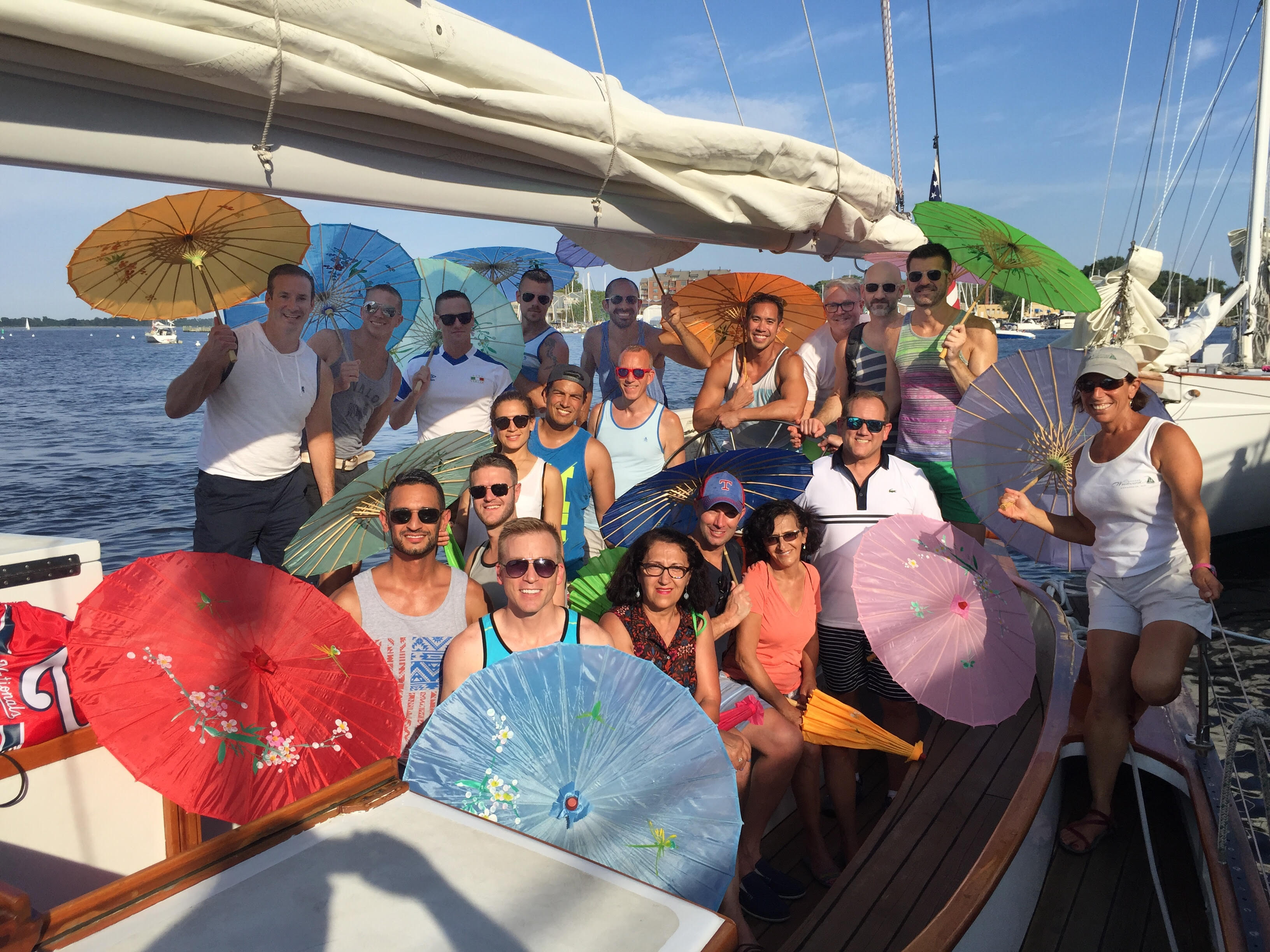Group enjoying a birthday party on the schooner with Oriental Umbrellas