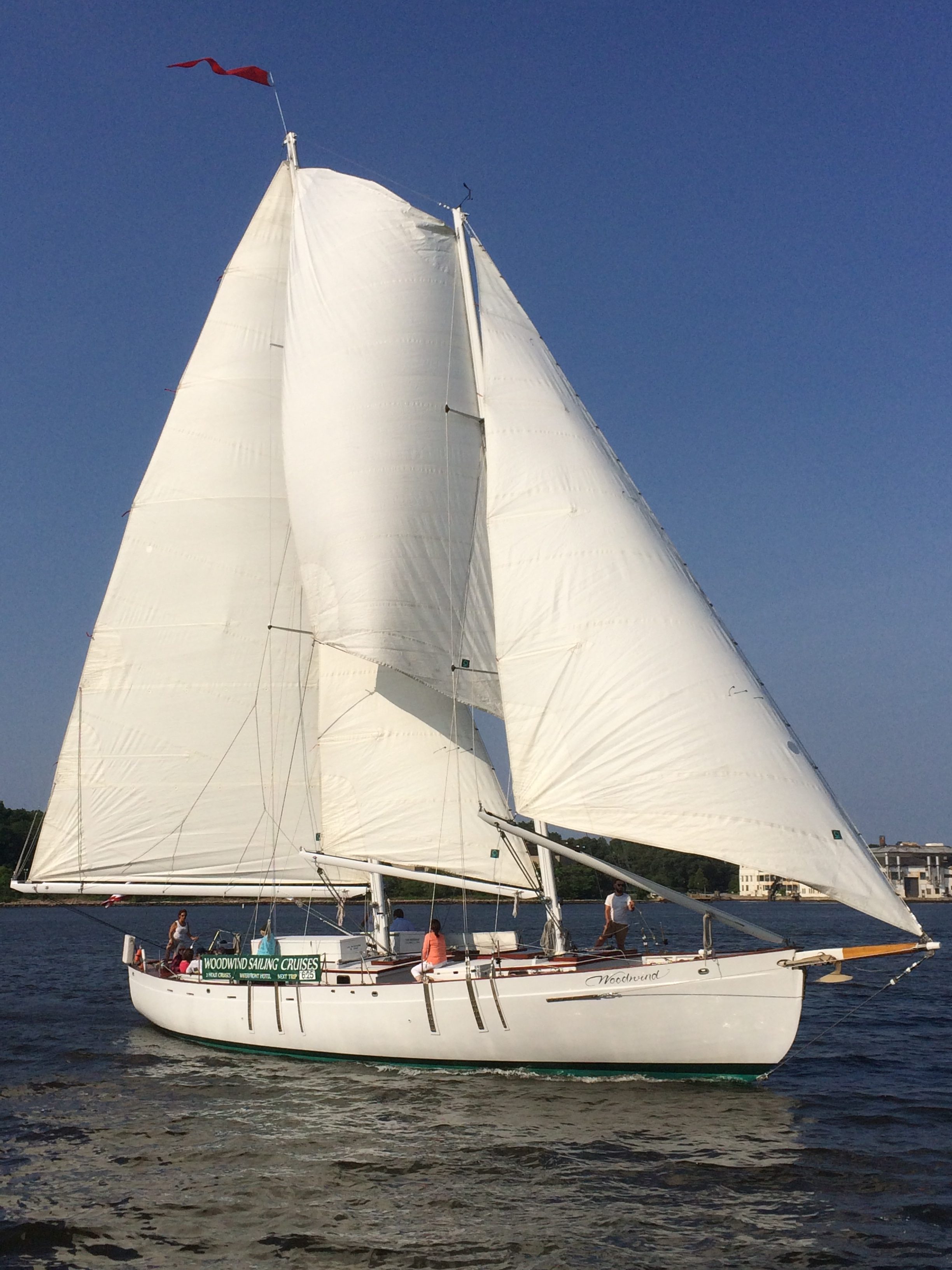 Schooner full sails on a brilliant blue sky day