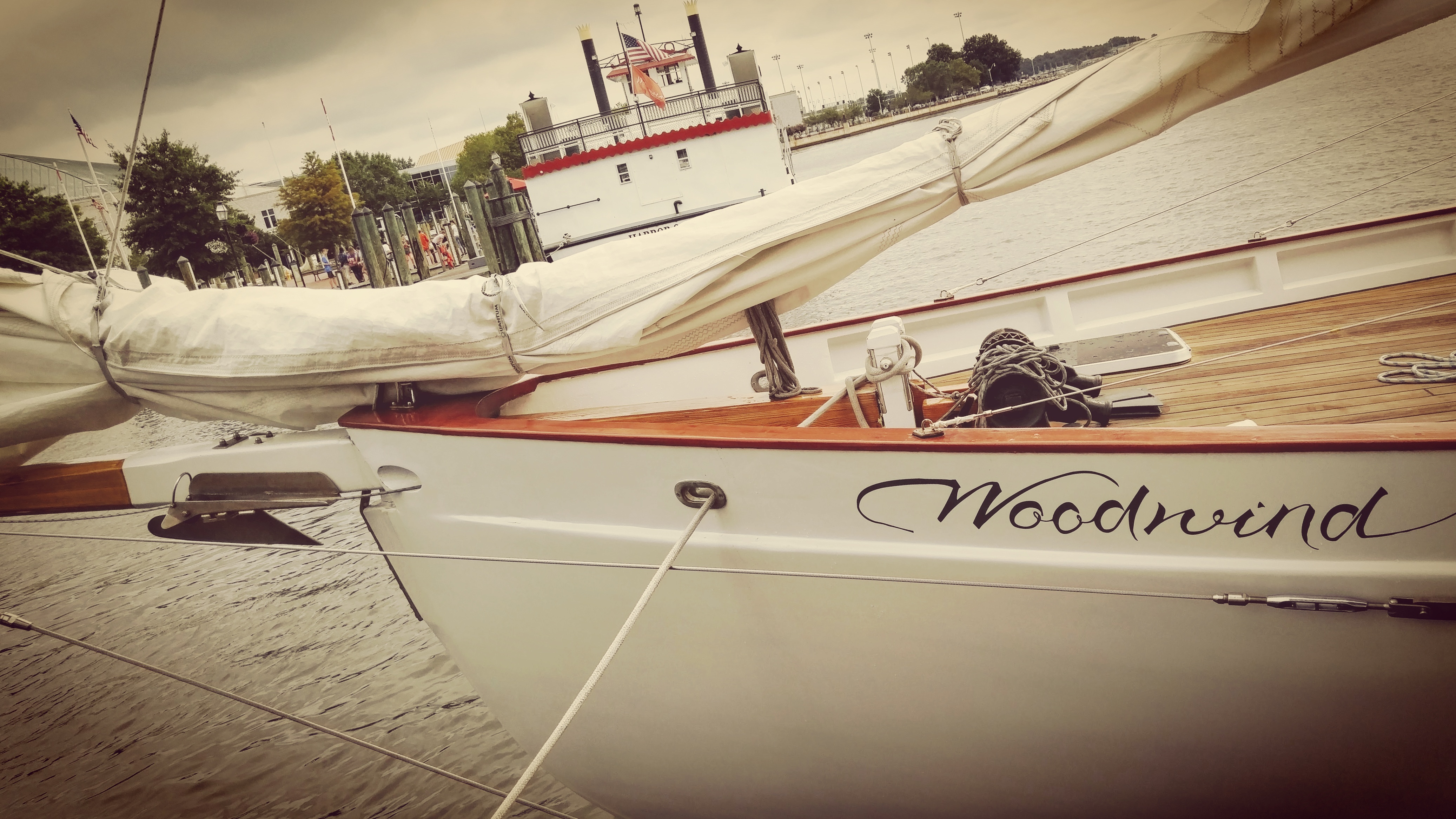 Bow of Schooner Woodwind with Annapolis Harbor Queen behind it