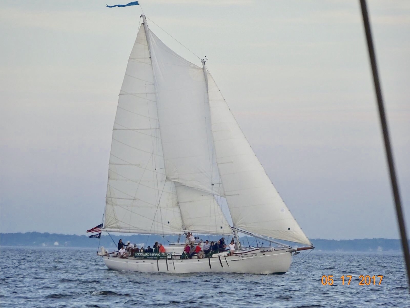 Schooner flying with sails full of wind