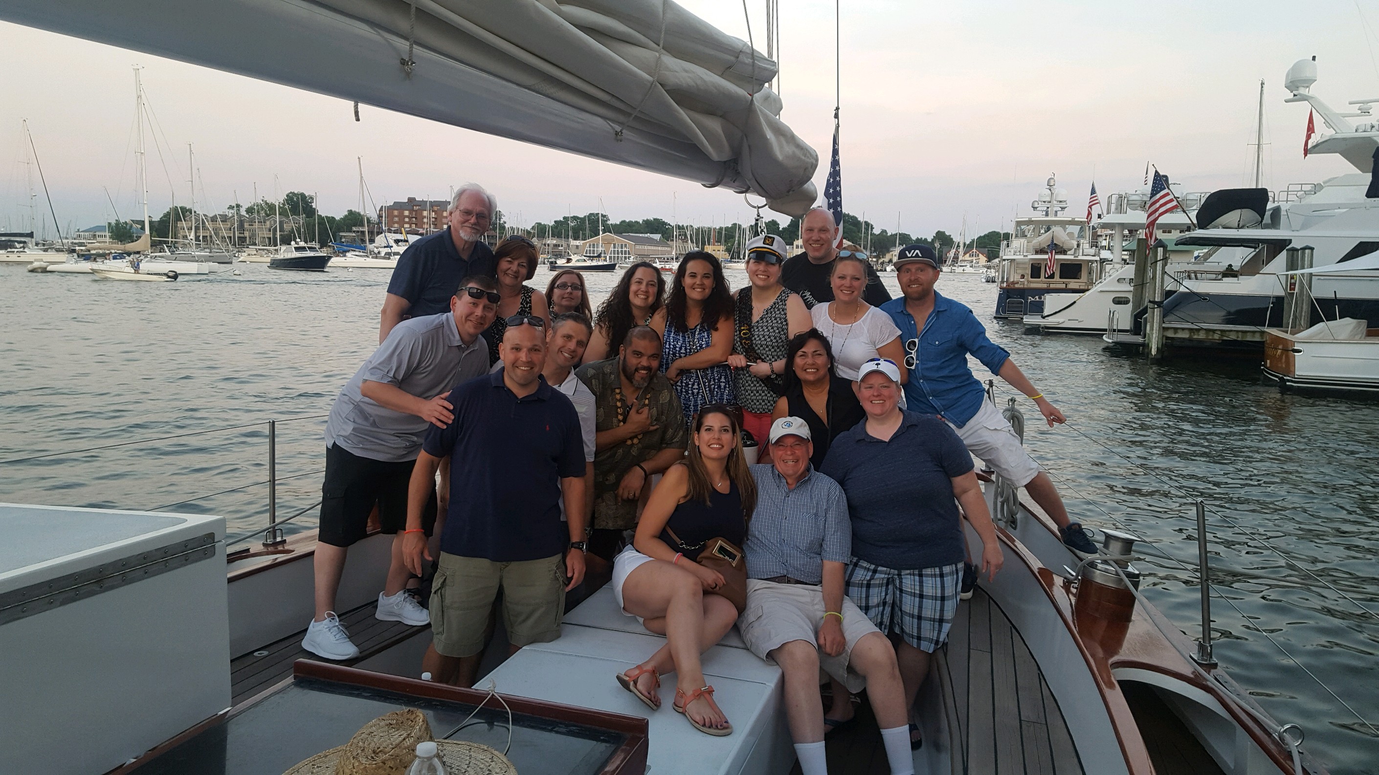 Large group of family and friends celebrating a birthday on board