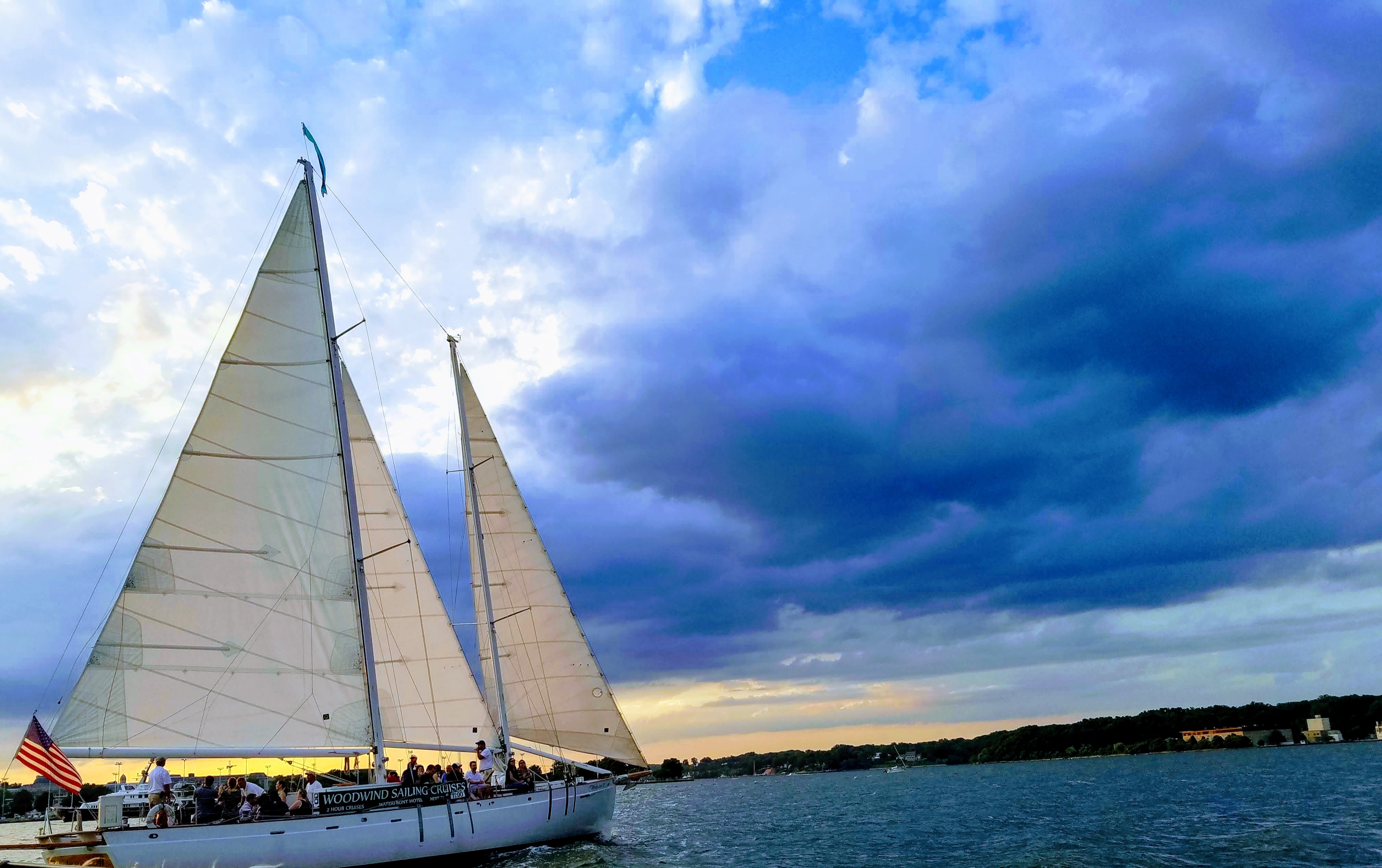 Sailing into a dramatic blue and yellow cloudy sunset