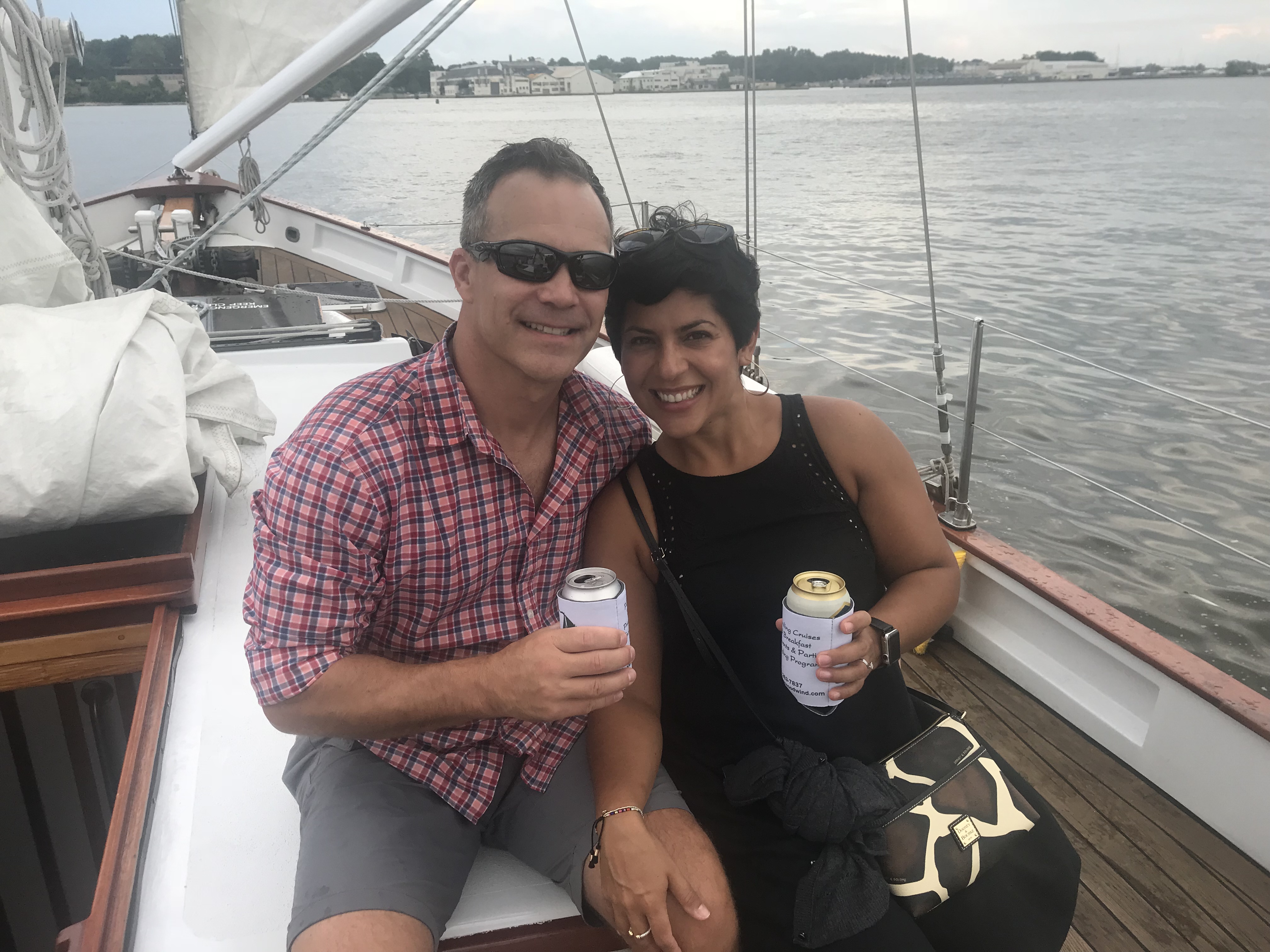 Couple enjoying a refreshment and sail aboard the schooner