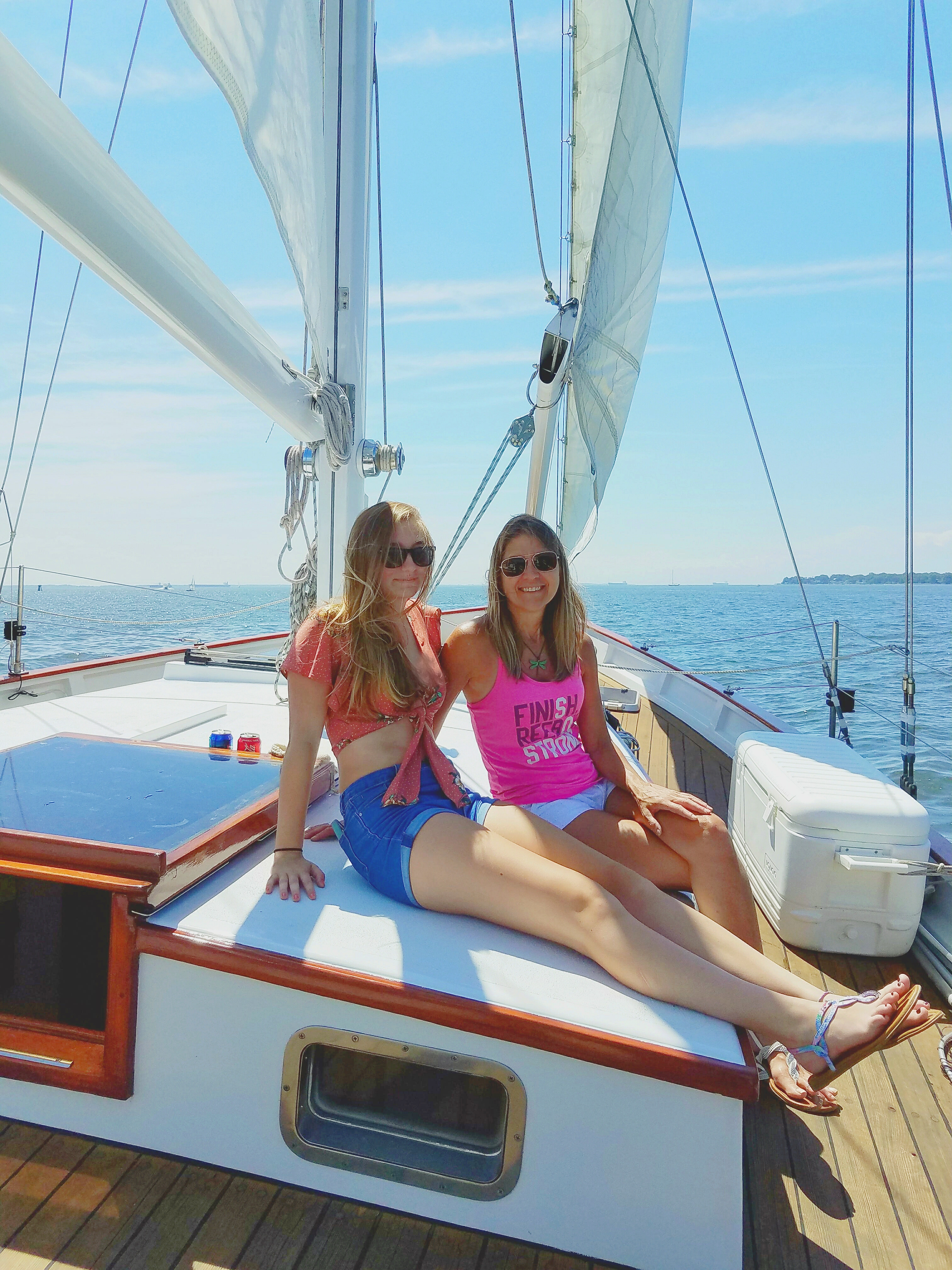 A mother and daughter enjoying the sun on a sail