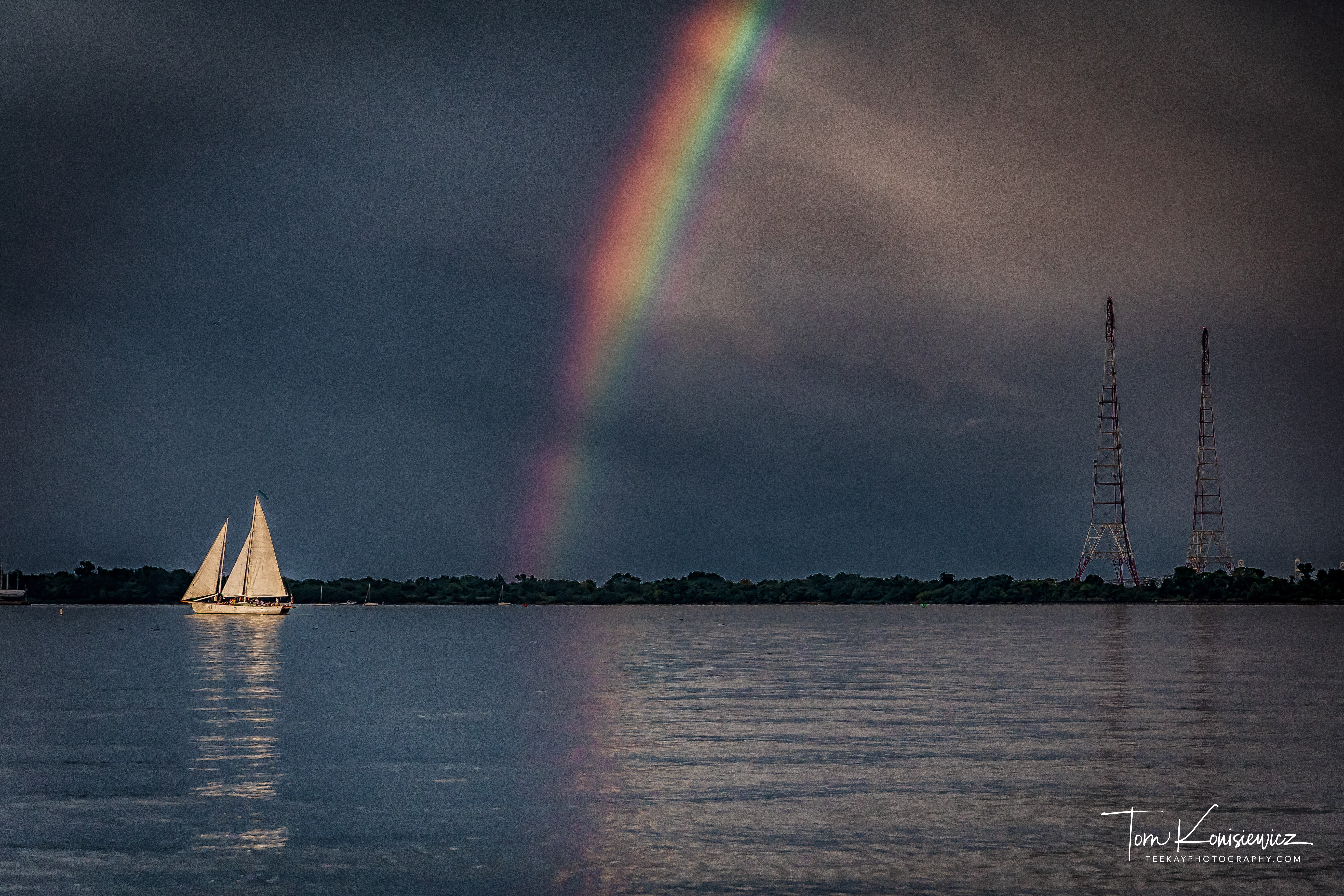 Schooner at the end of a rainbow after storm