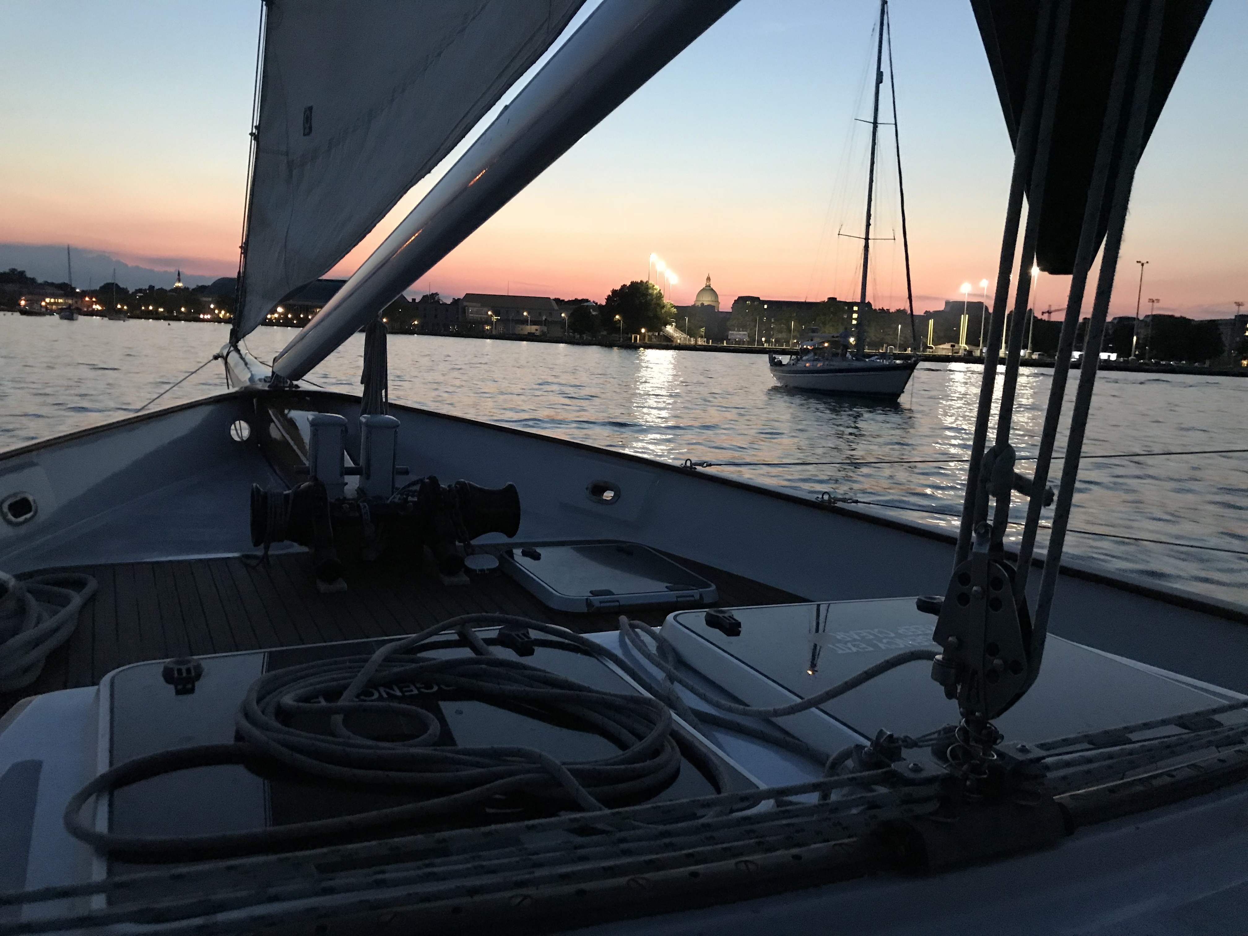 Dusk aboard the schooner looking at the Naval Academy