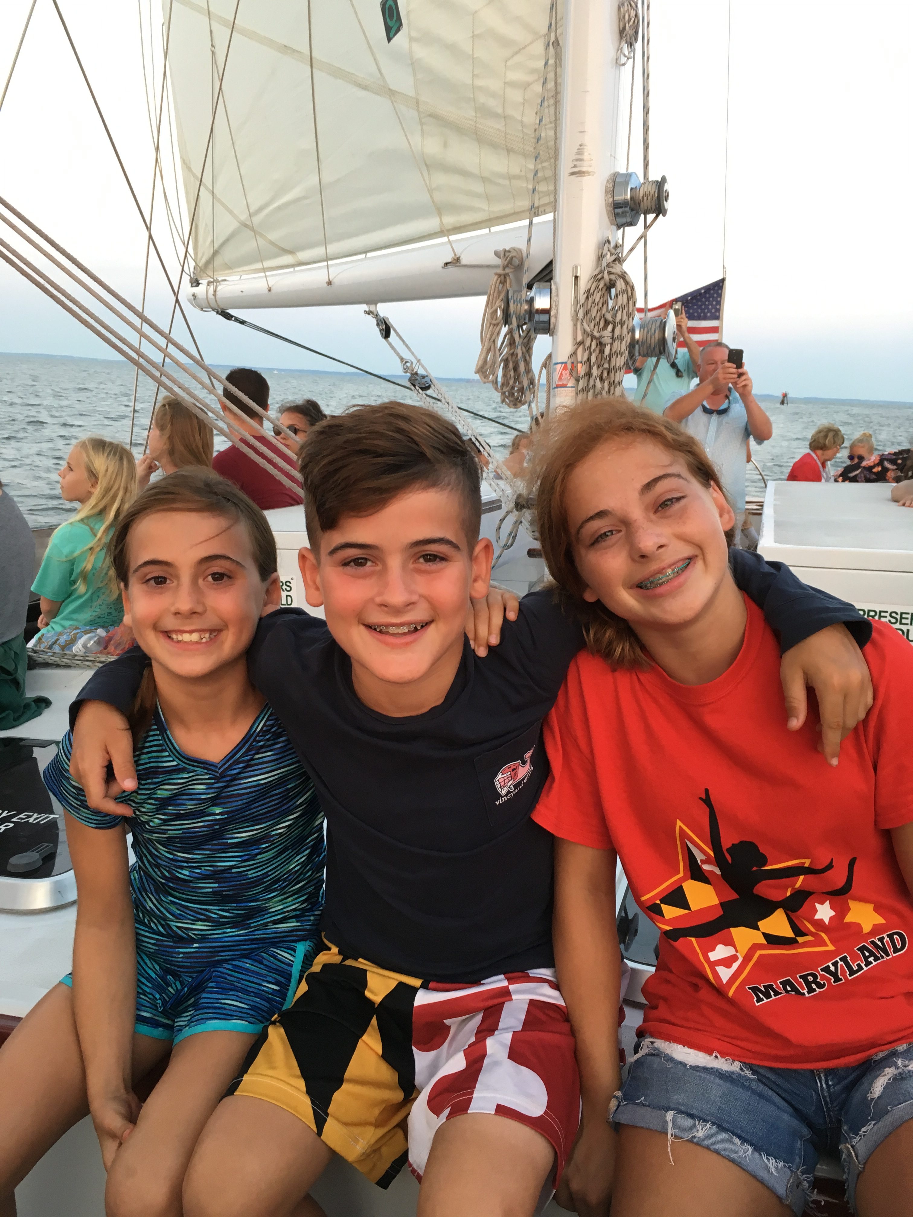 Three young people enjoying their sail