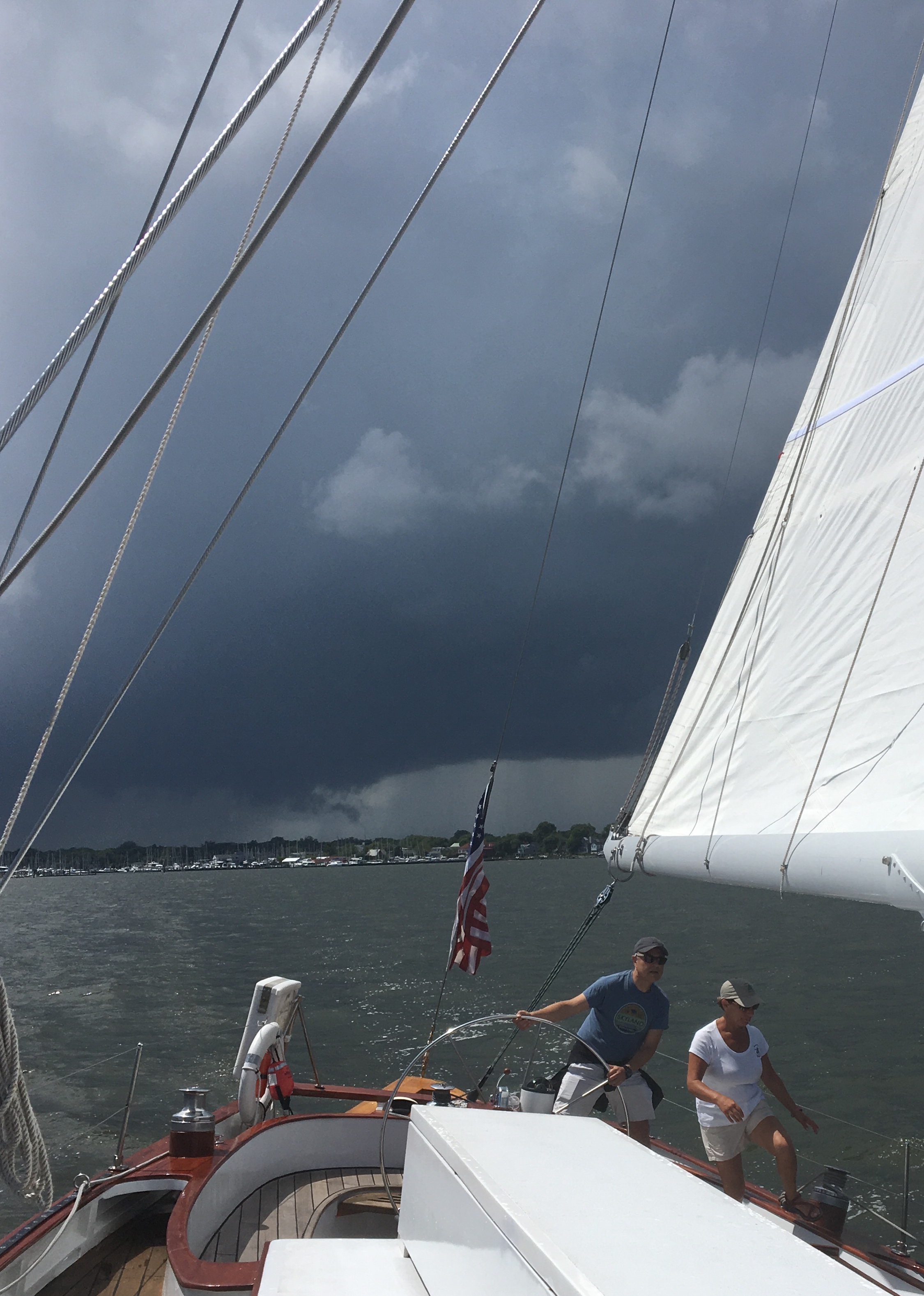 Sailing away from a dark stormy sky