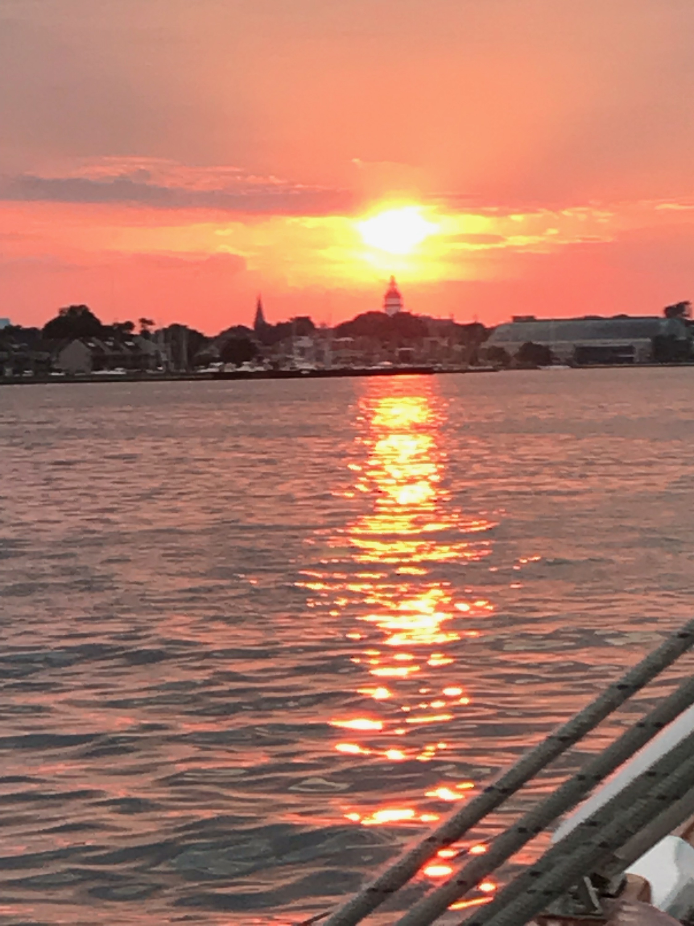 Sunset shining over Annapolis Capital building and water