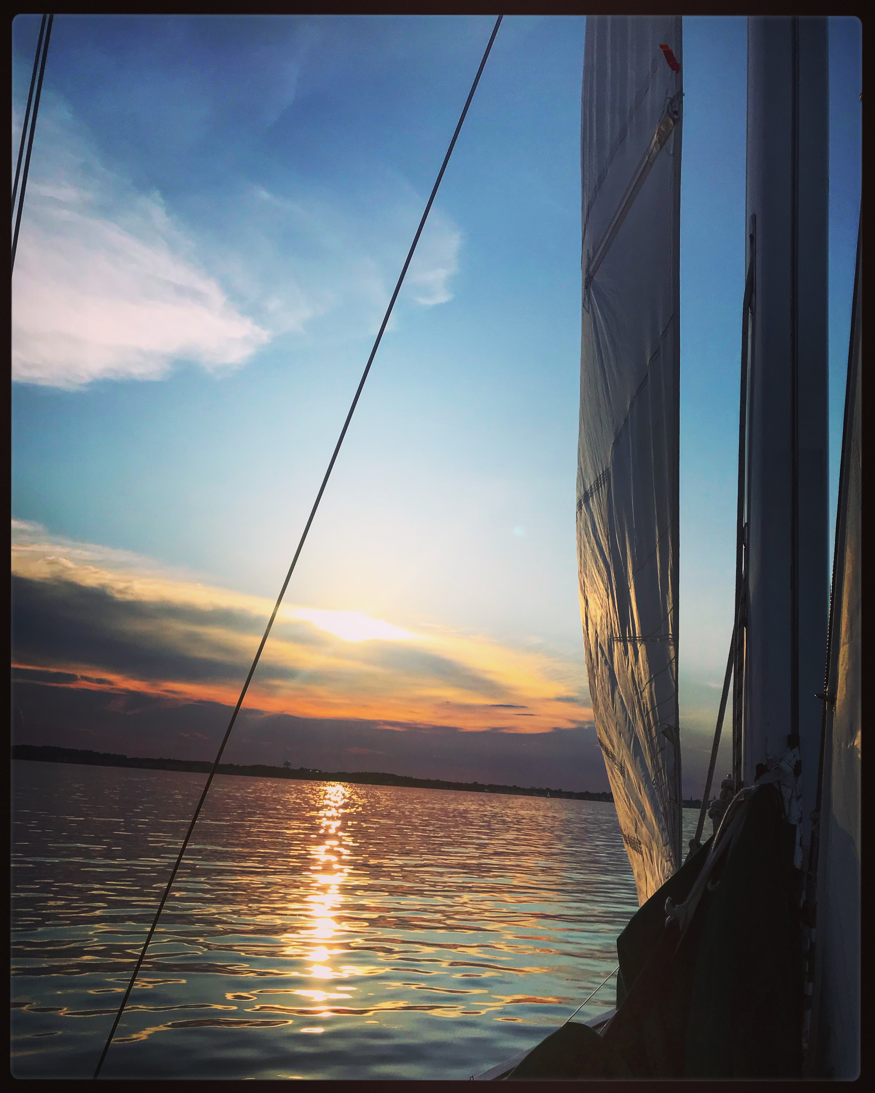 Sailing into the sunset with calm waters