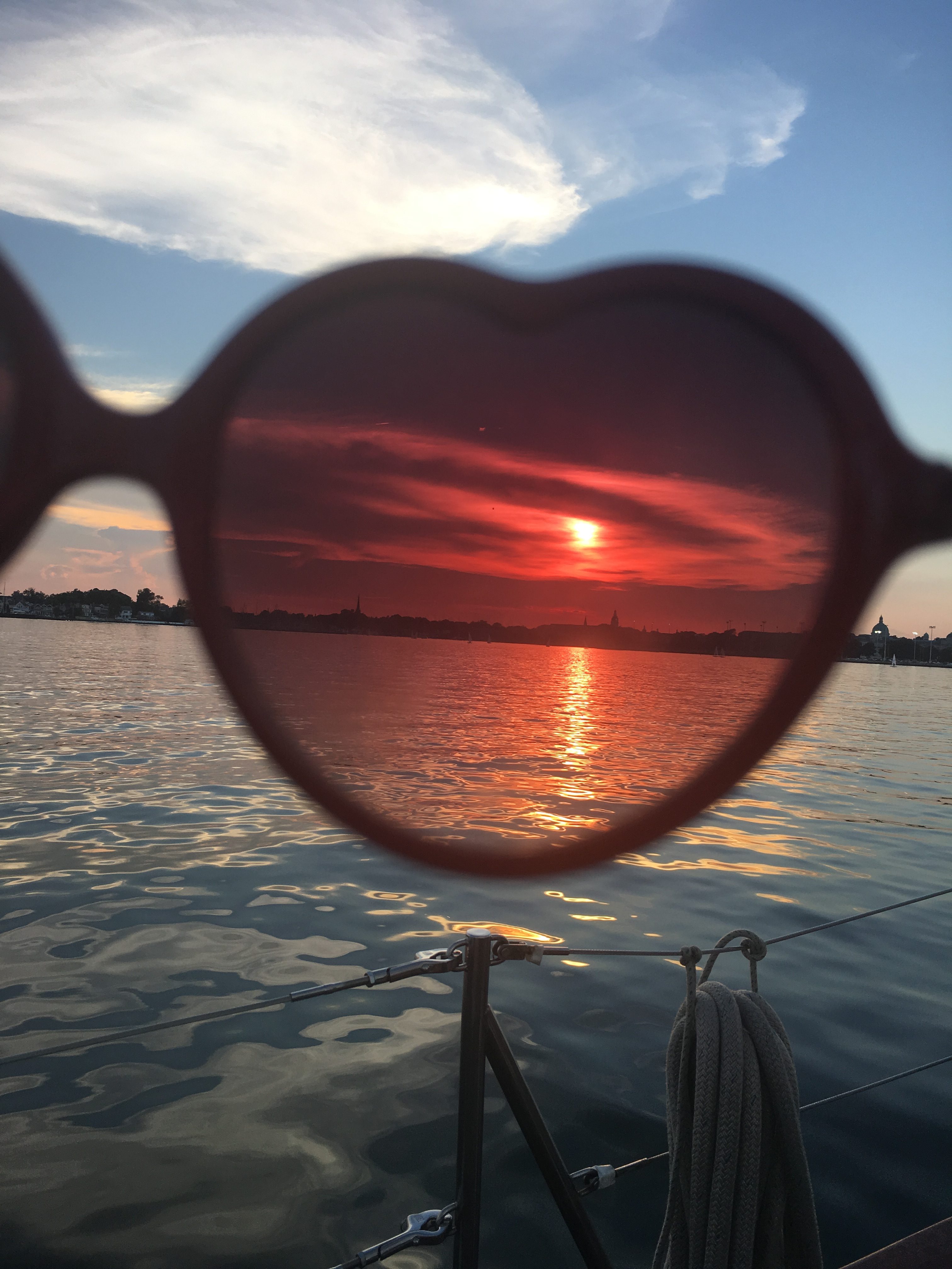 Sunset viewed through sunglasses from the boat
