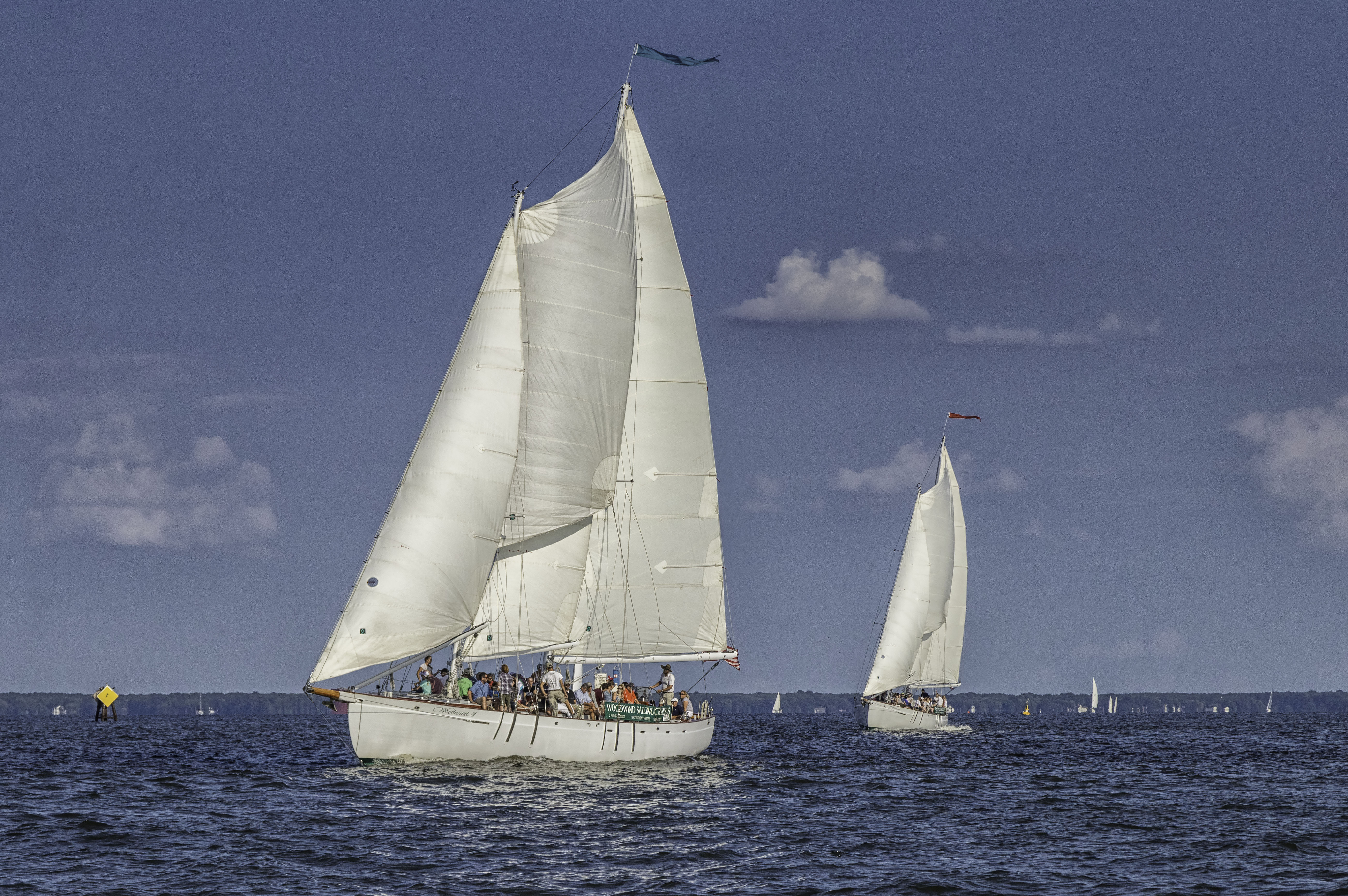 Both schooners following each other on the bay under sail