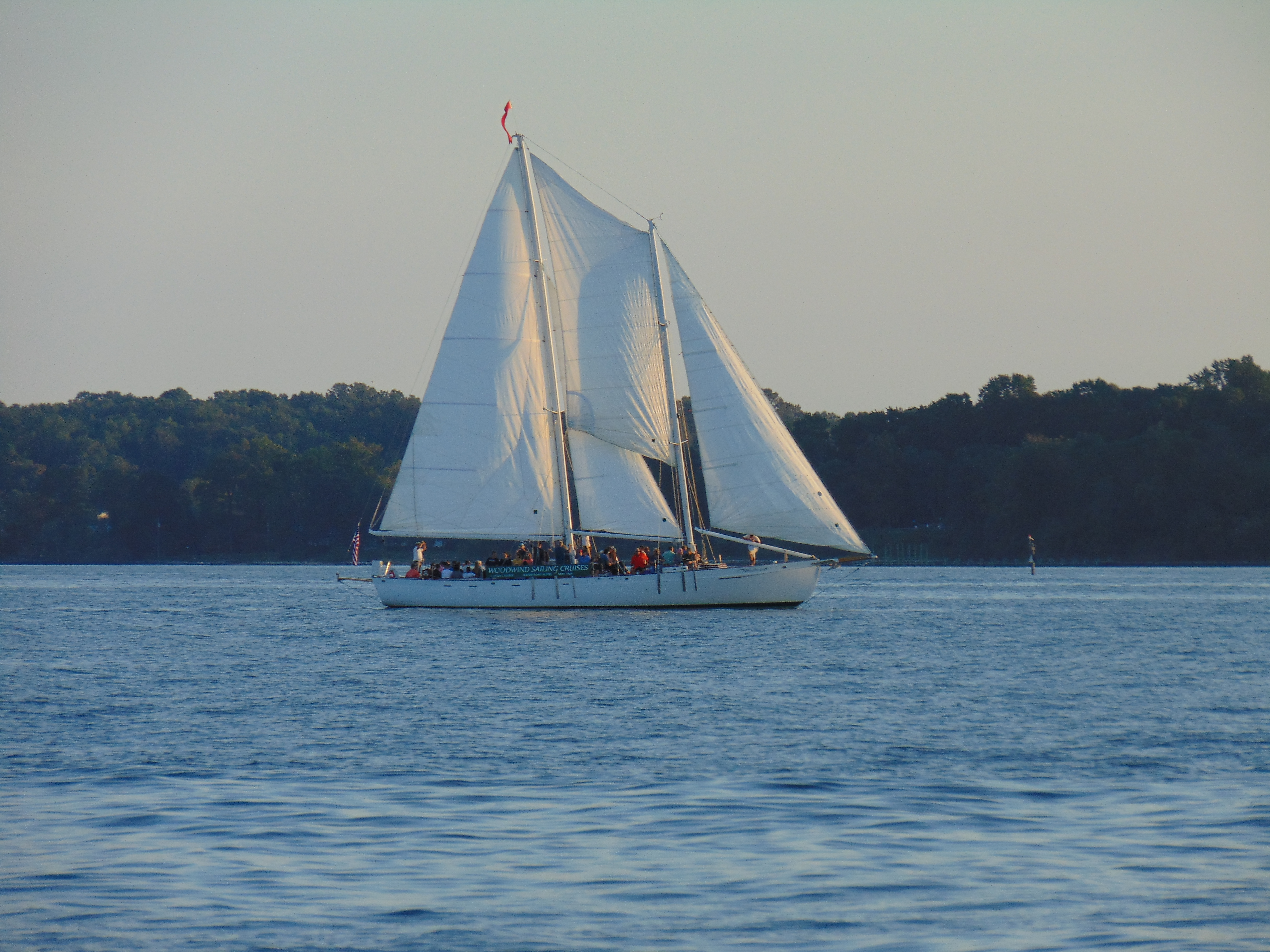 Schooner on a sunset cruise with calm blue waters on an October day