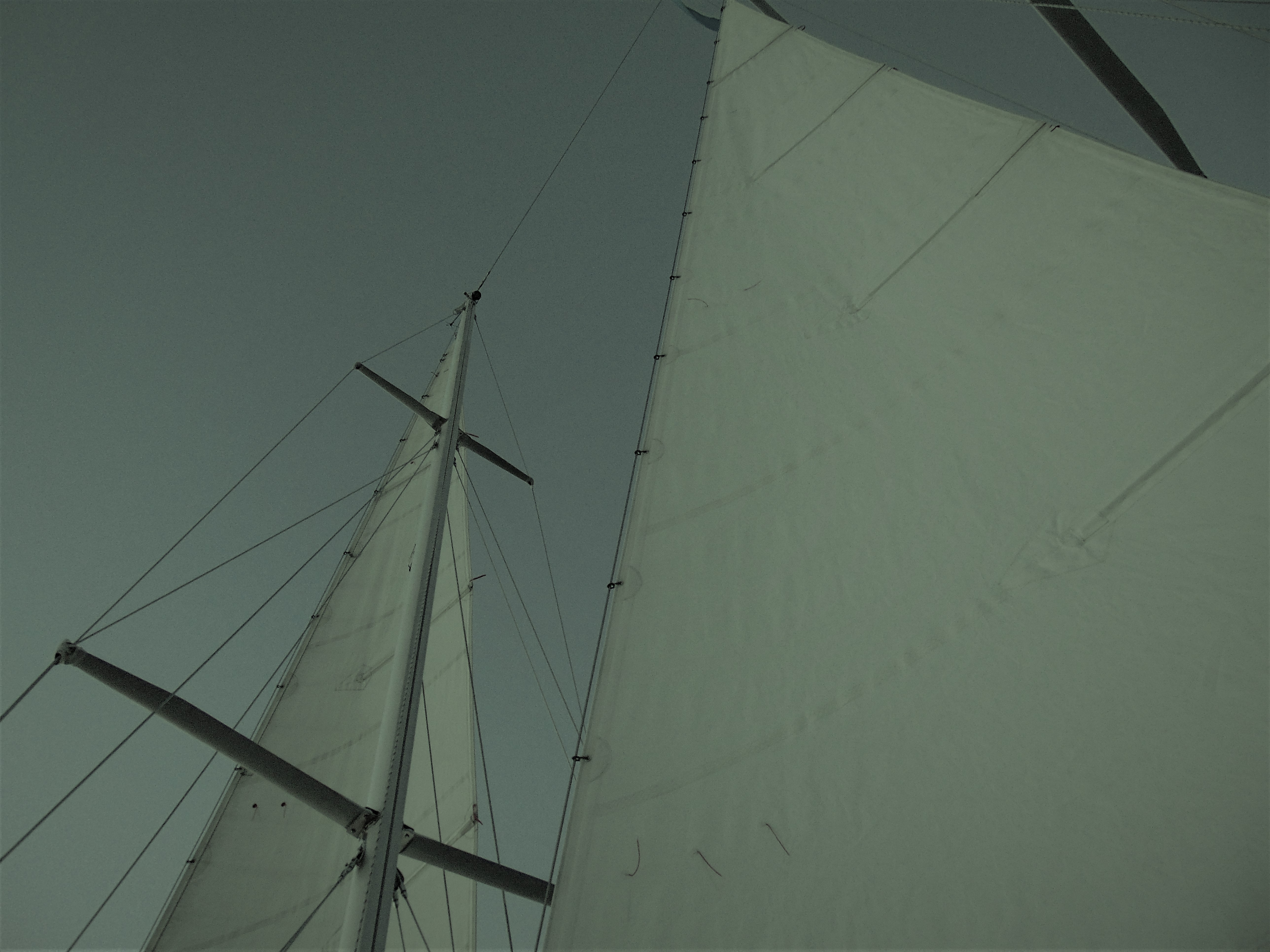 Looking up through the sails to an almost dark sky