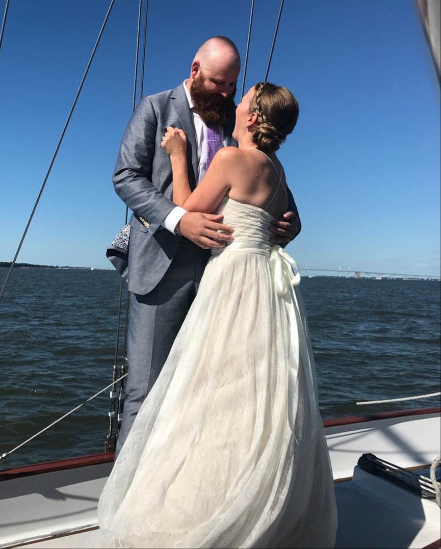 Bride and Groom getting married on schooner