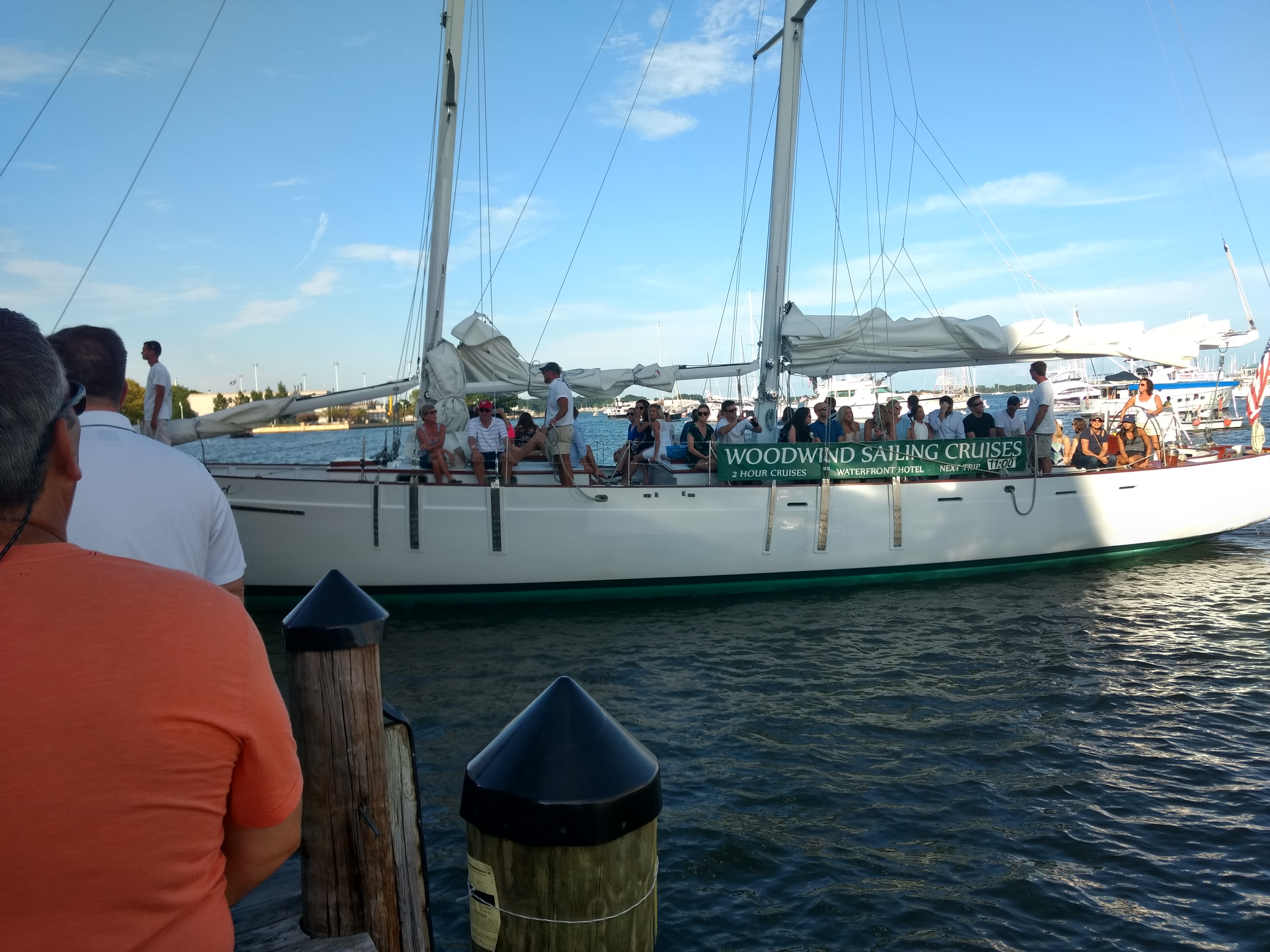 Schooner sails down and motoring into port