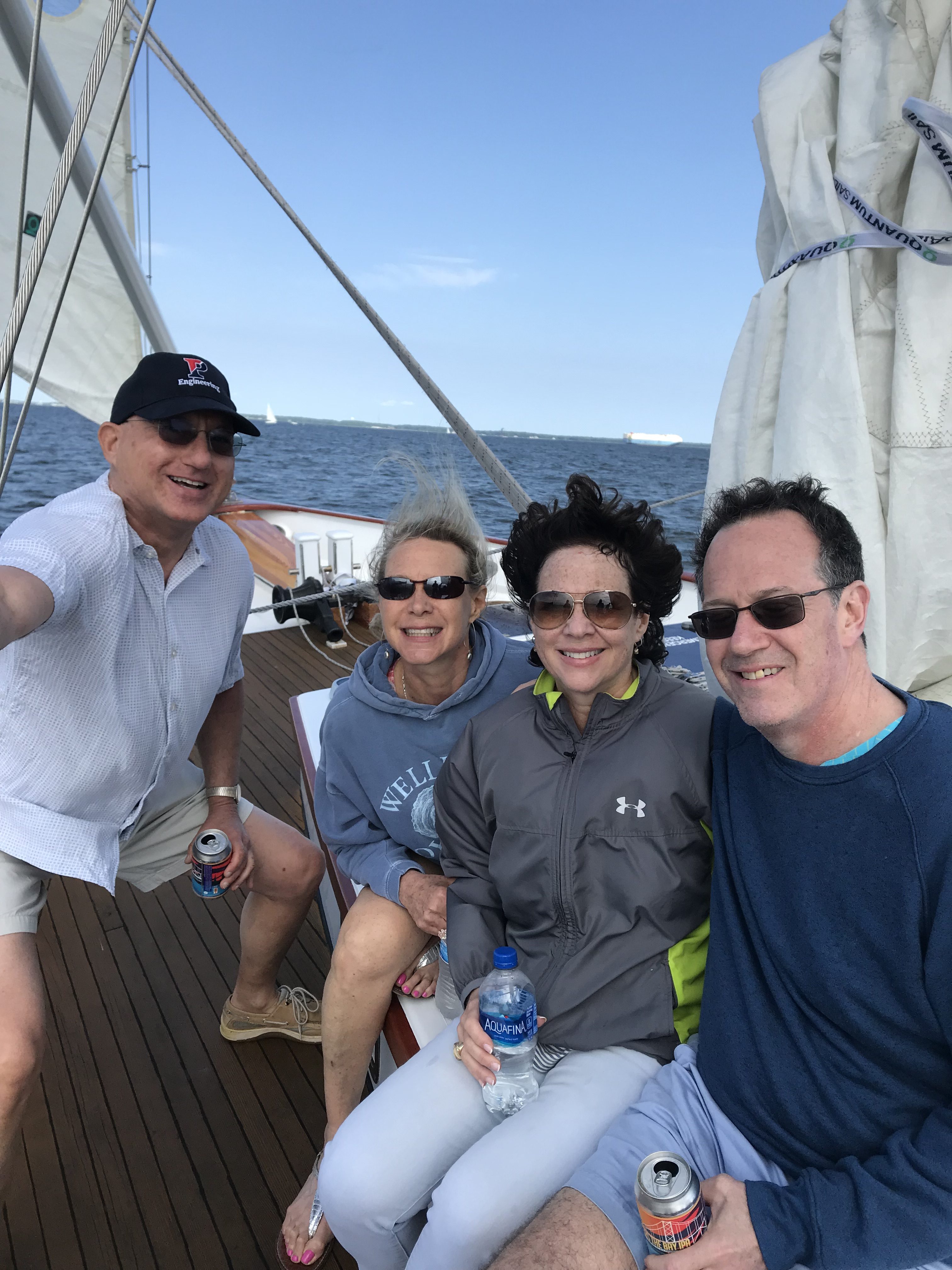 Four people smiling and having fun on the schooner