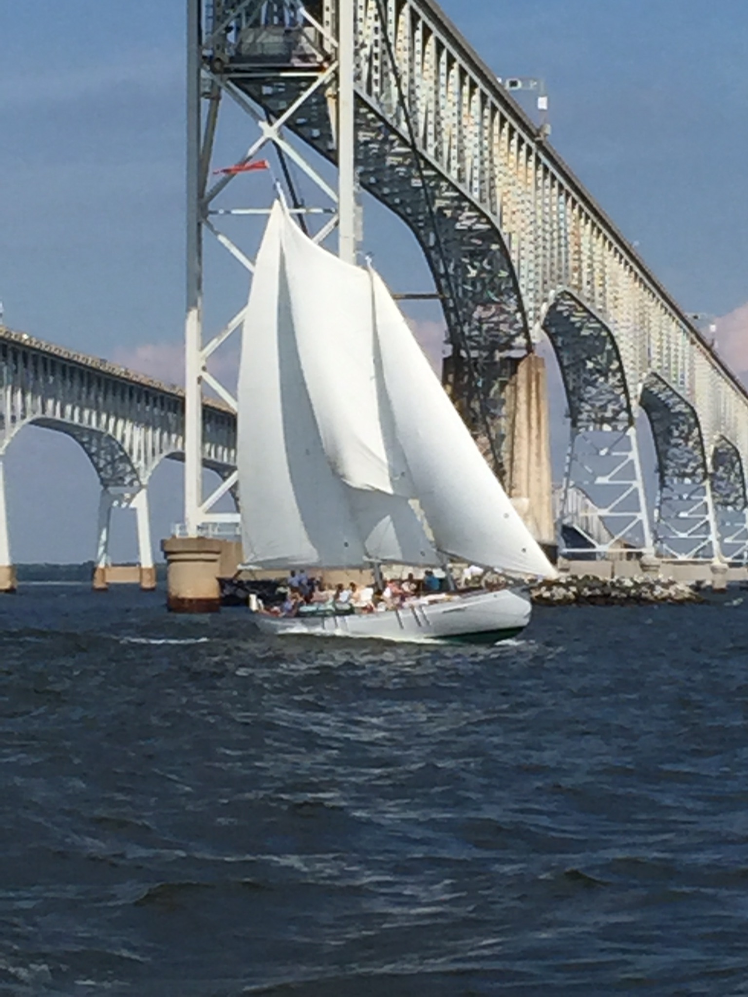 Schooner flying under the Bay Bridge