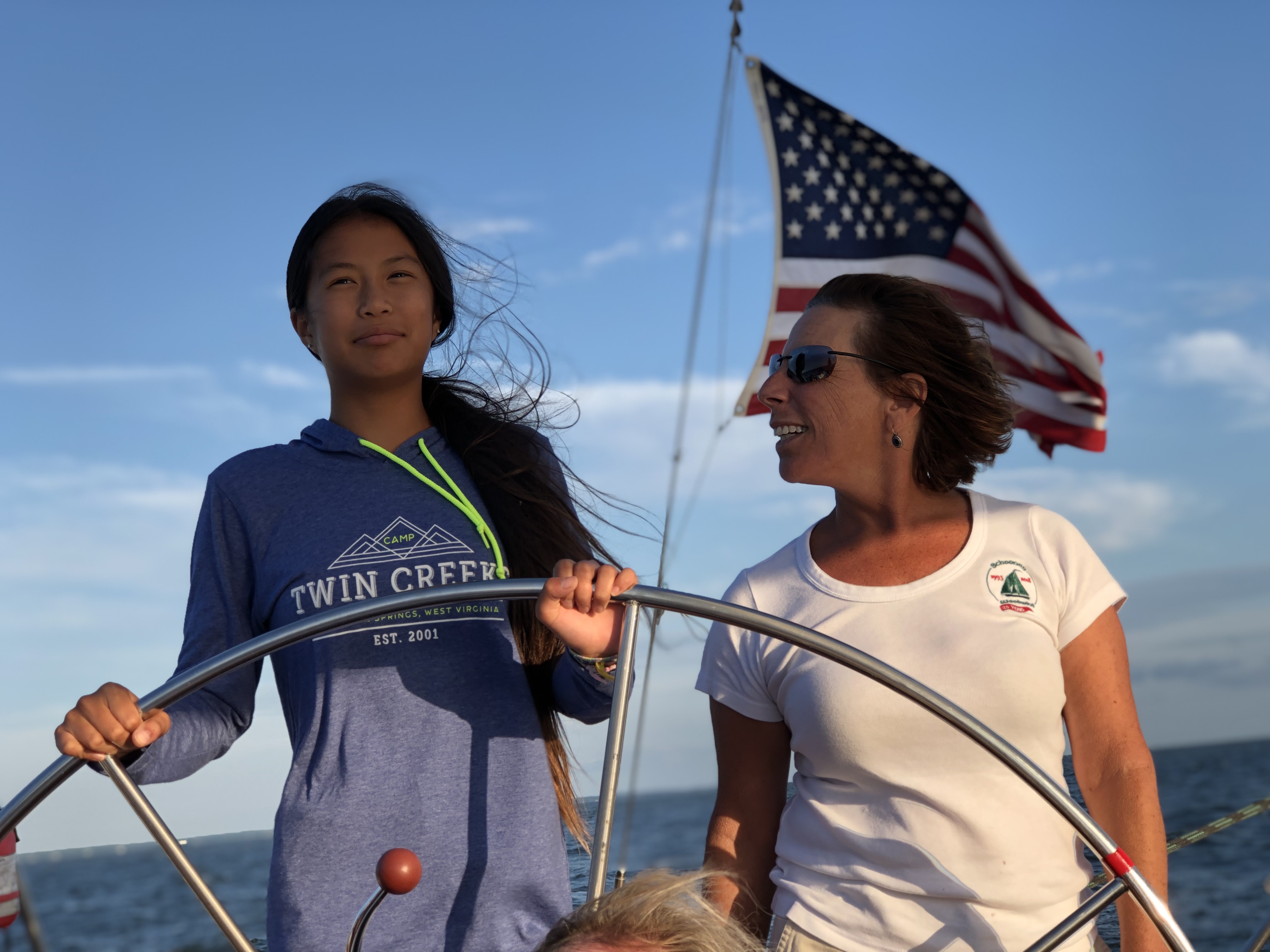 Captain teaching young lady how to navigate the Chesapeake