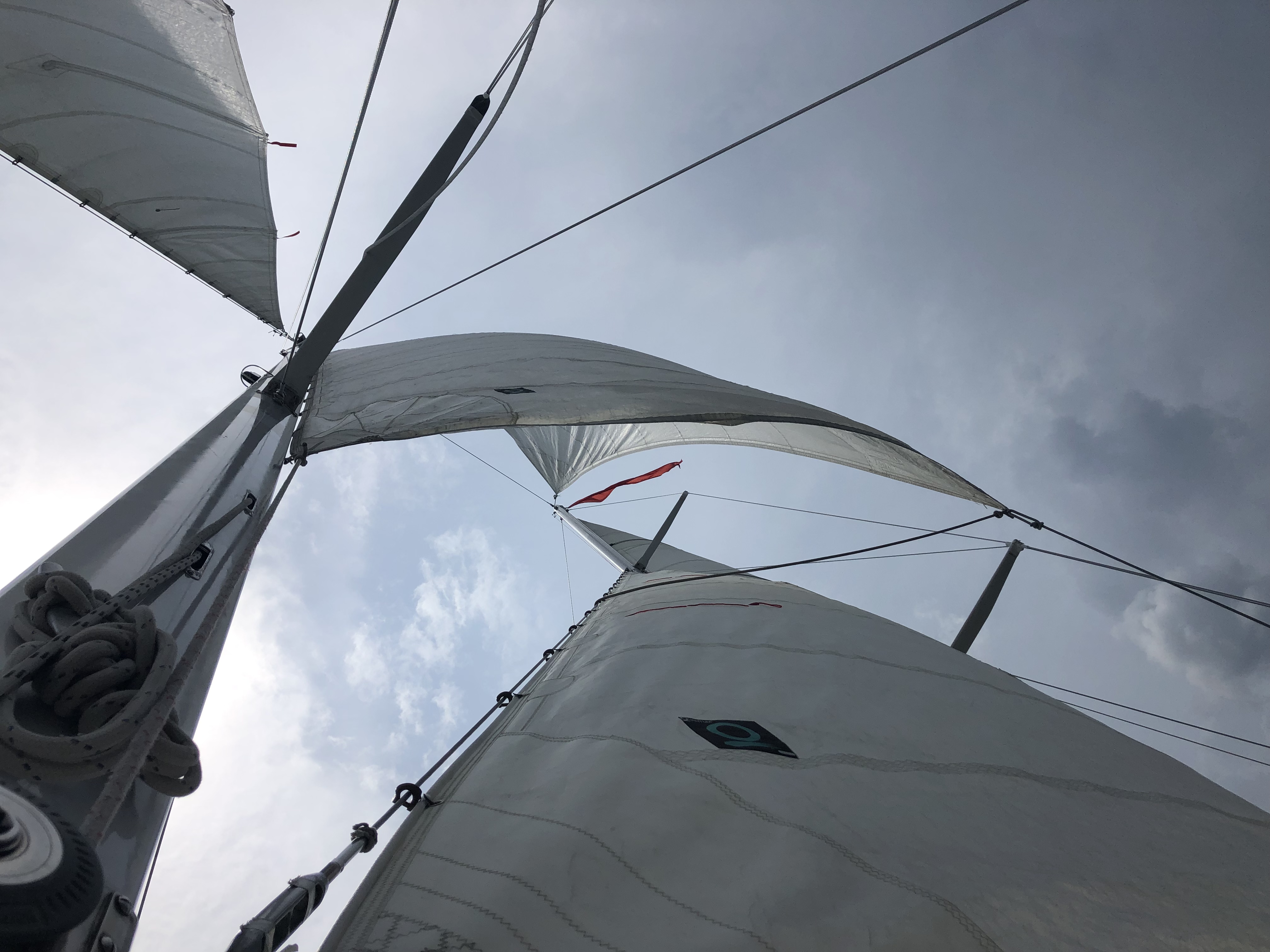 Looking up through the sails on a cloudy day