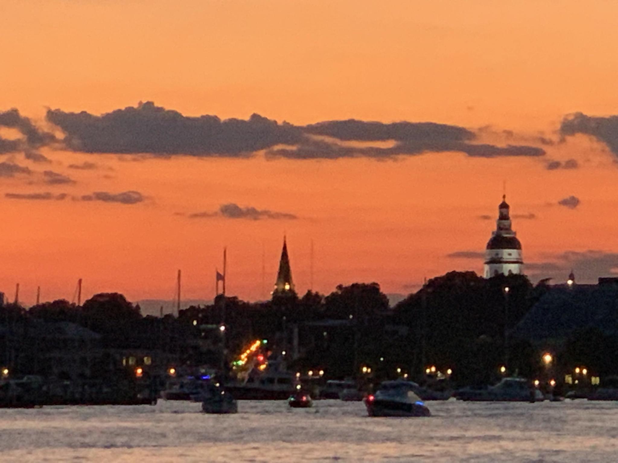 Annapolis harbor at dusk with Capital building lit up