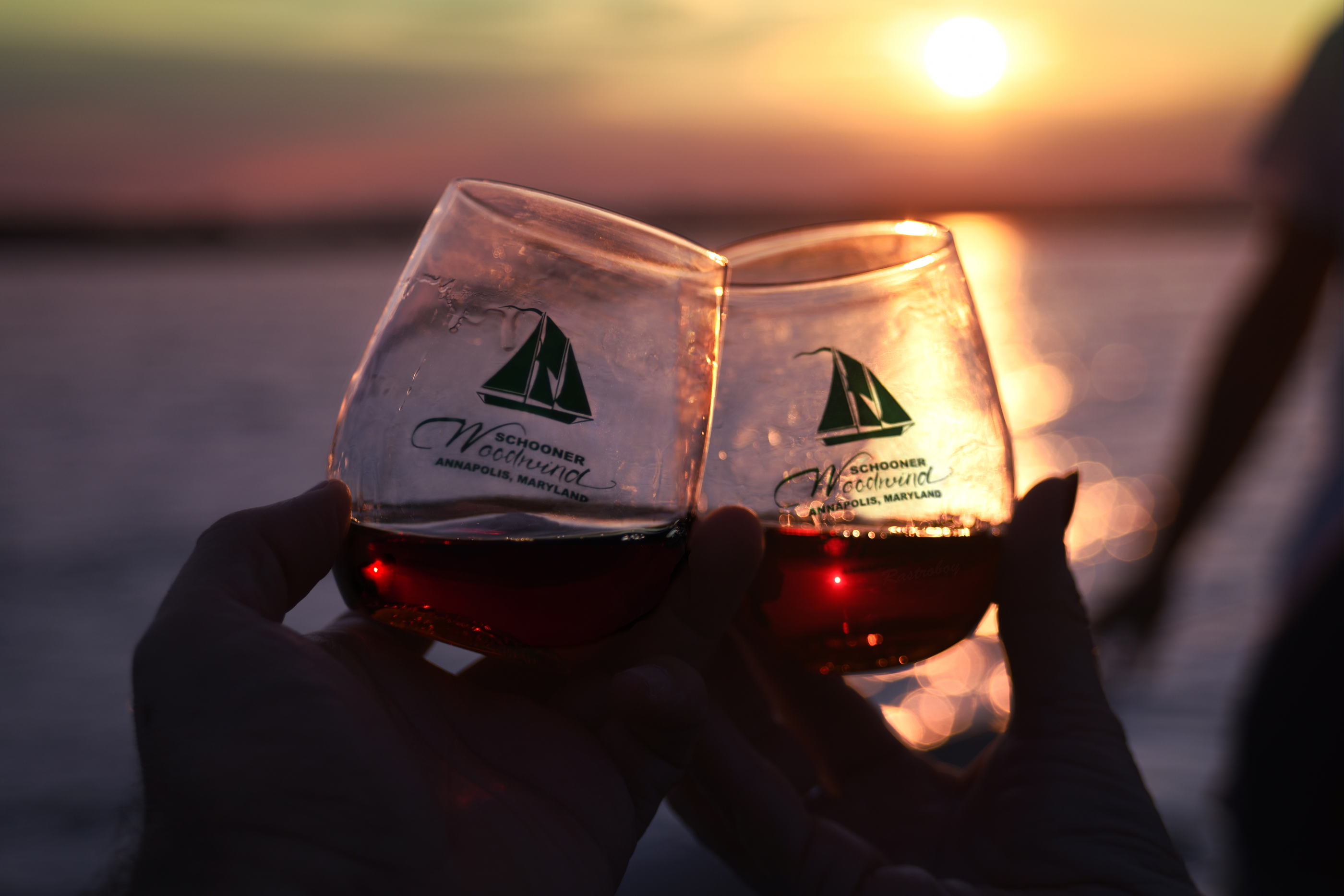 Two glasses of red wine at sunset